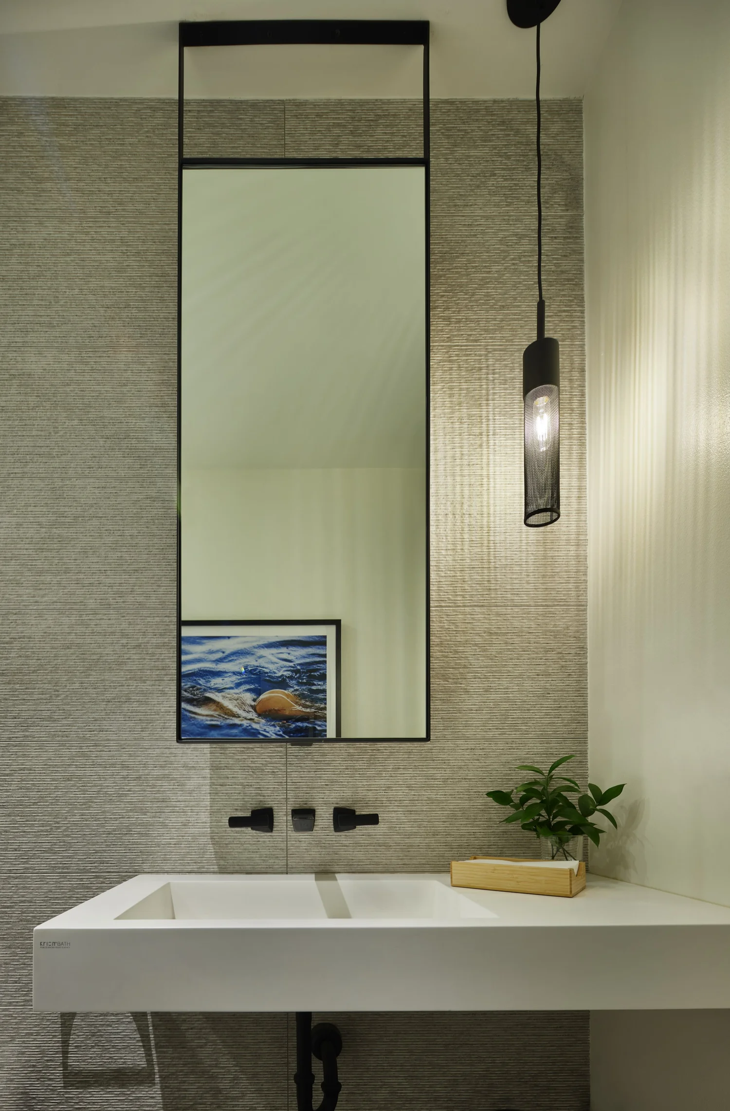 Open-concept kitchen — island, herringbone tile, integrated appliances